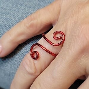 Elegant Red Swirl Ring